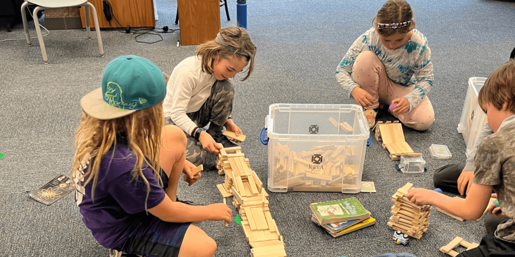 kids playing with learning toy in library