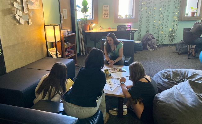 Students with Tess Amer in Fairview High School Wellness Center