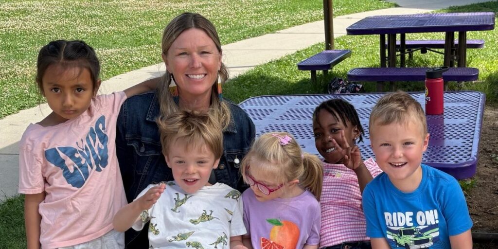 teacher and students smiling