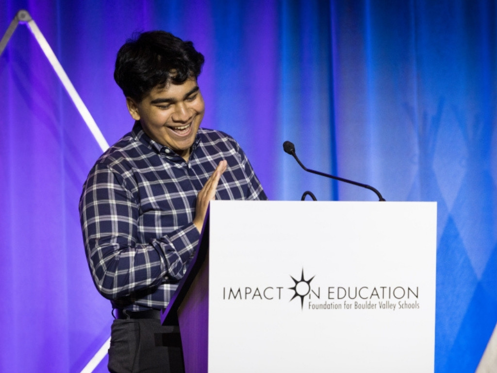 Josue speaking at Impact on Education Gala
